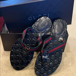 Gucci Embossed Flip Flops with Red and Green Stripes